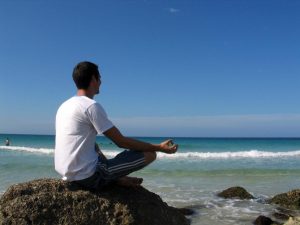 Meditating by the Beach